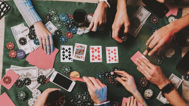 Young,Friends,Playing,Poker,On,Party,At,Home.,Playing,Games.