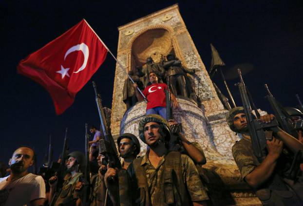 Turkish military stand in front of the Republic Monument at the Taksim Square in Istanbul