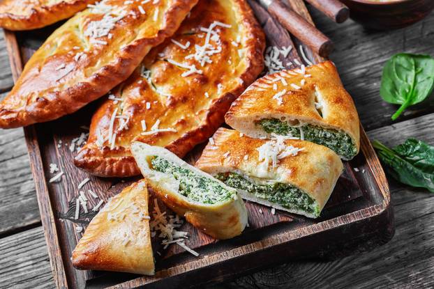 close-up of a calzones wth Spinach and Cheese