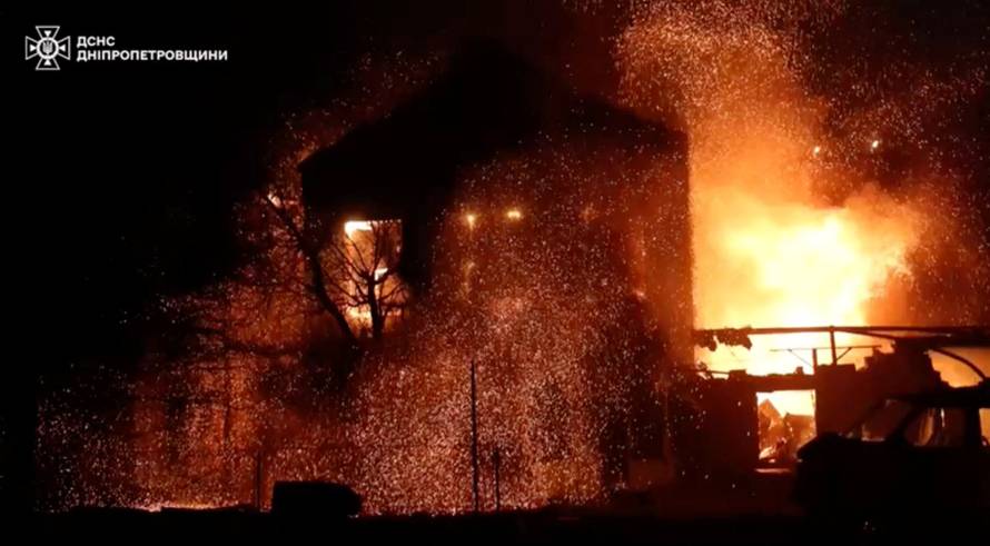 Smoke and flames rise from a building at the site of a Russian drone strike, amid Russia's attack on Ukraine, in a location given as Dnipropetrovsk region