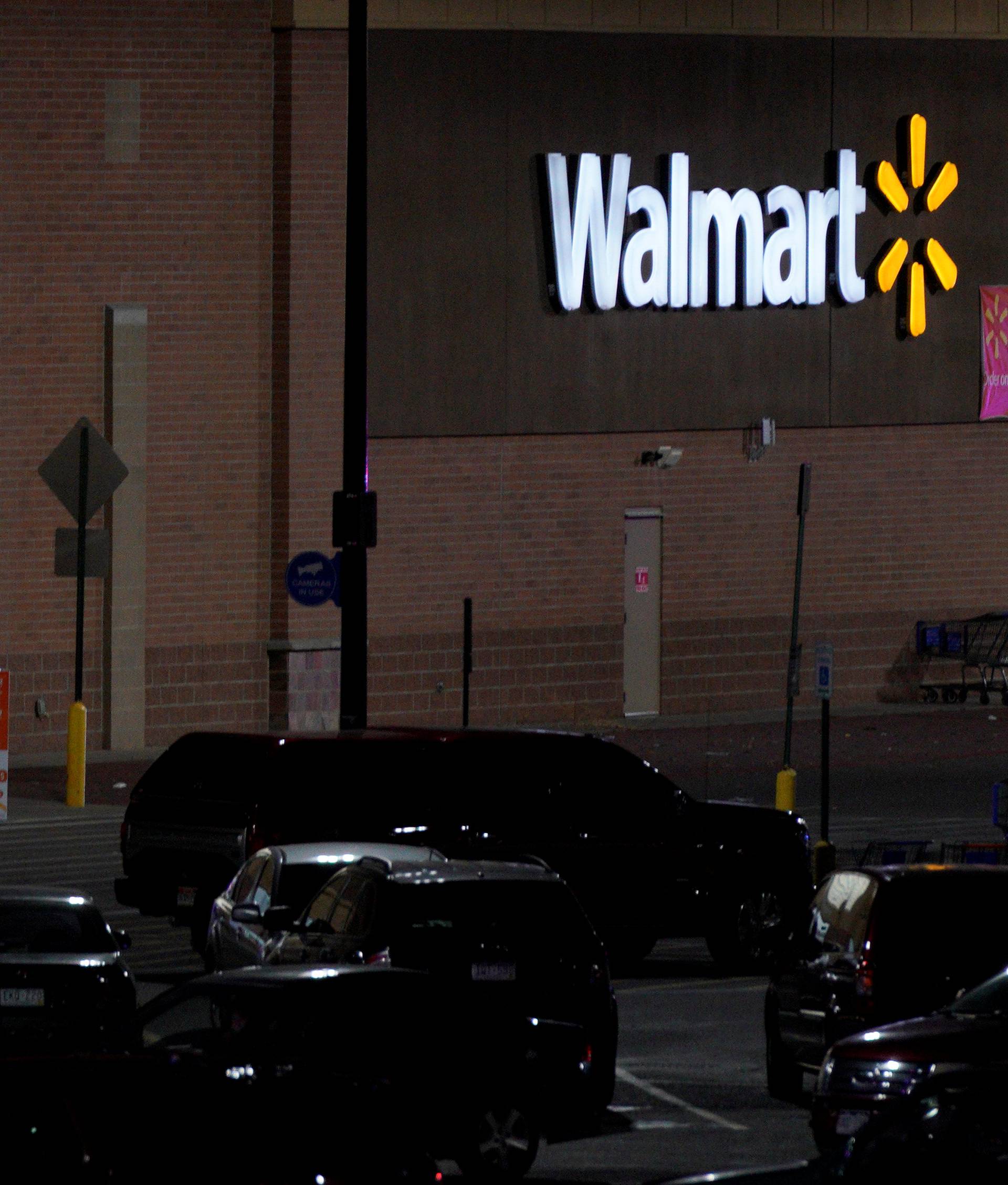 Police guard the entrance at the scene of a shooting at a Walmart in Thornton