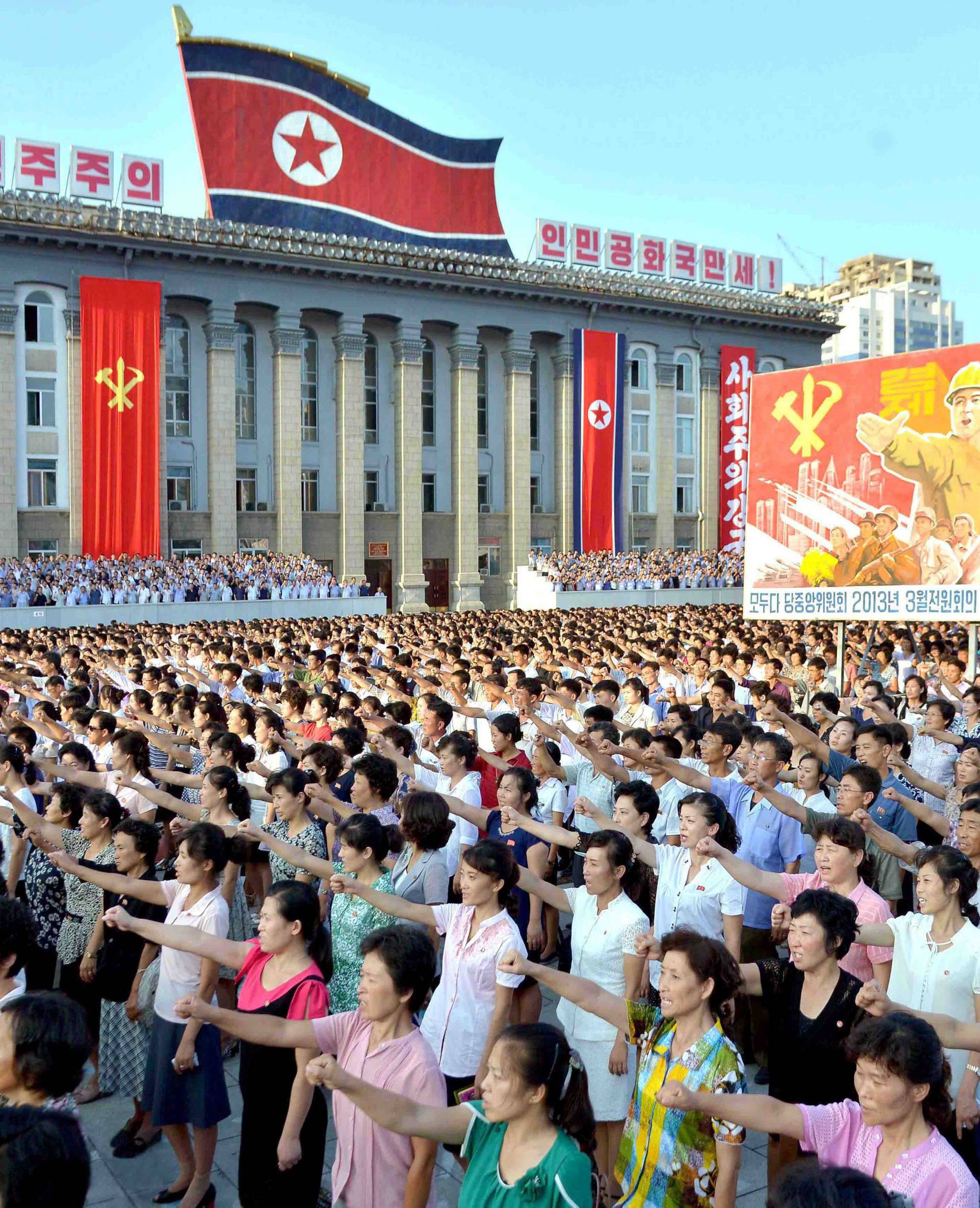 People participate in a Pyongyang city mass rally held at Kim Il Sung Square to fully support the statement of the DPRK government