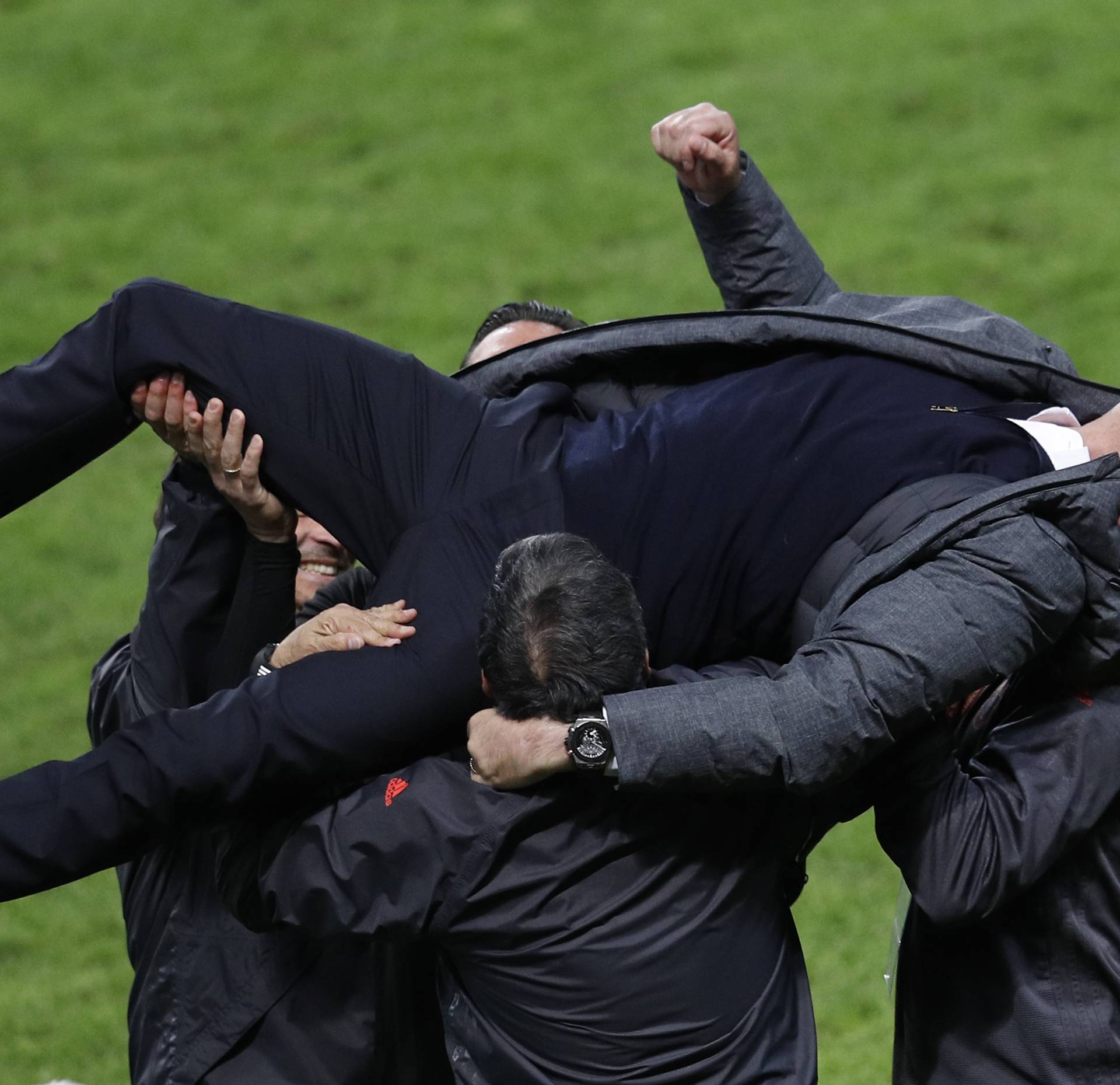 Manchester United manager Jose Mourinho celebrates with coaching staff