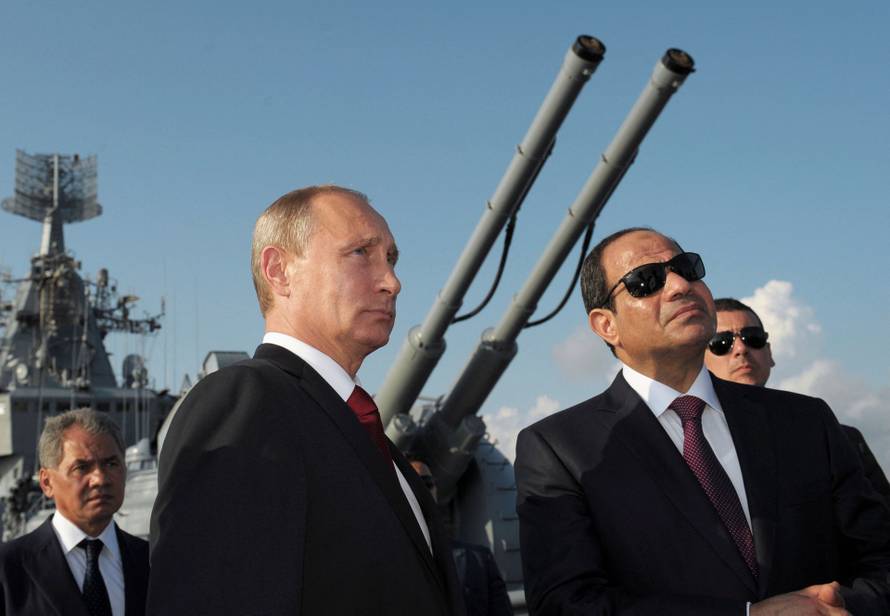 FILE PHOTO: Russia's President Putin, his Egyptian counterpart Sisi and Russia's Defence Minister Shoigu attend a welcoming ceremony onboard guided missile cruiser Moskva in Sochi