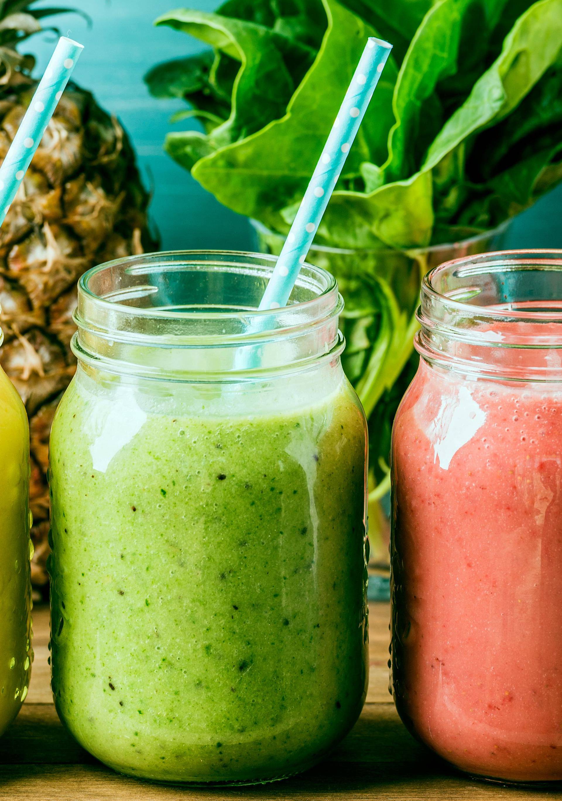 Freshly blended fruit smoothies of various colors and tastes