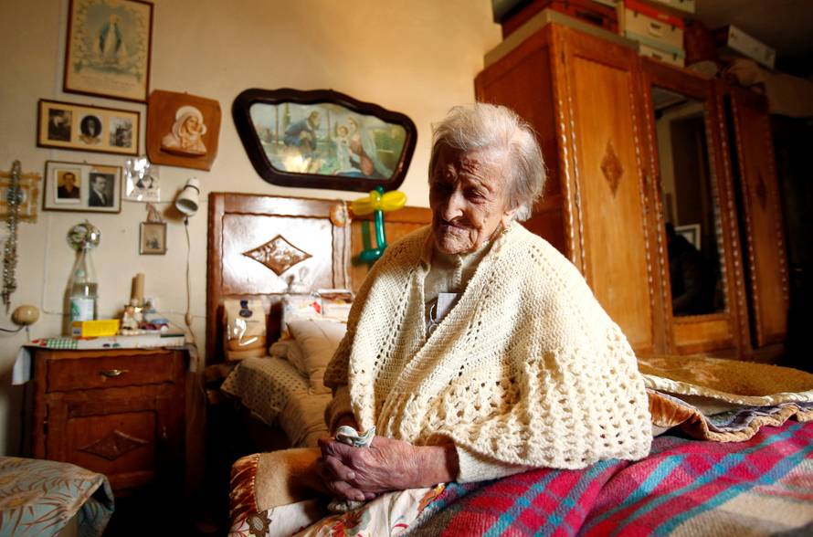 Emma Morano, thought to be the world's oldest person and the last to be born in the 1800s, sits on her bed during her 117th birthday in Verbania