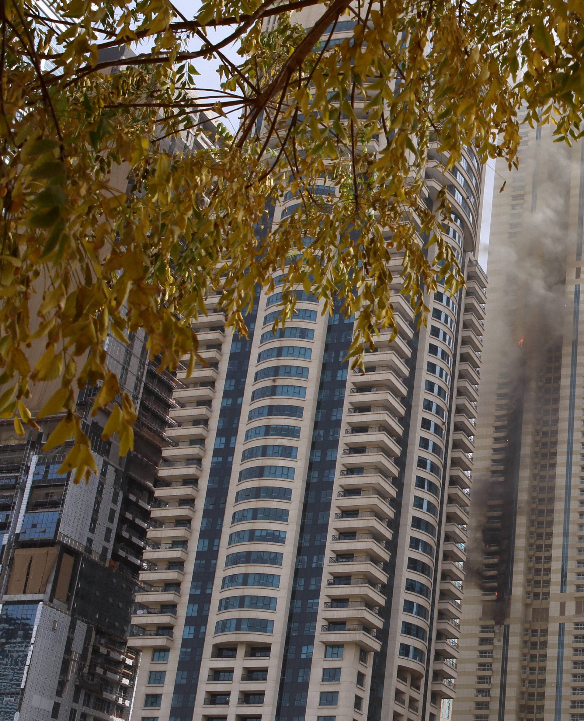 Flames are seeen after a fire broke out at residential Sulafa tower in the upscale Marina district in Dubai 