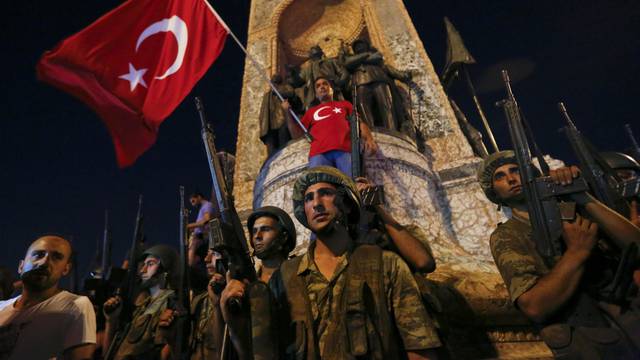 Turkish military stand in front of the Republic Monument at the Taksim Square in Istanbul