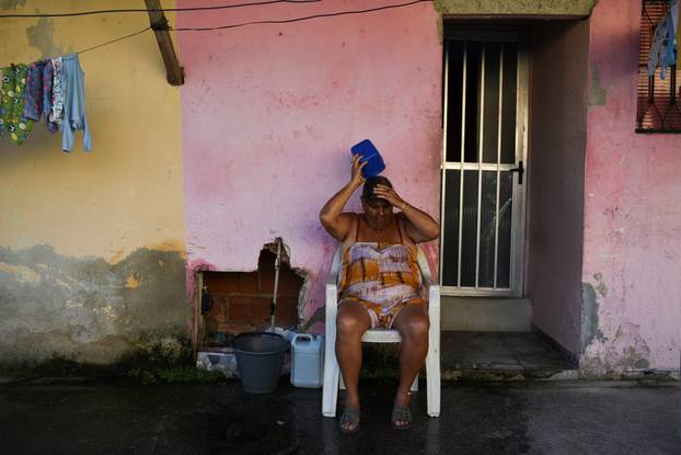 A woman cools herself in Rio de Janeiro