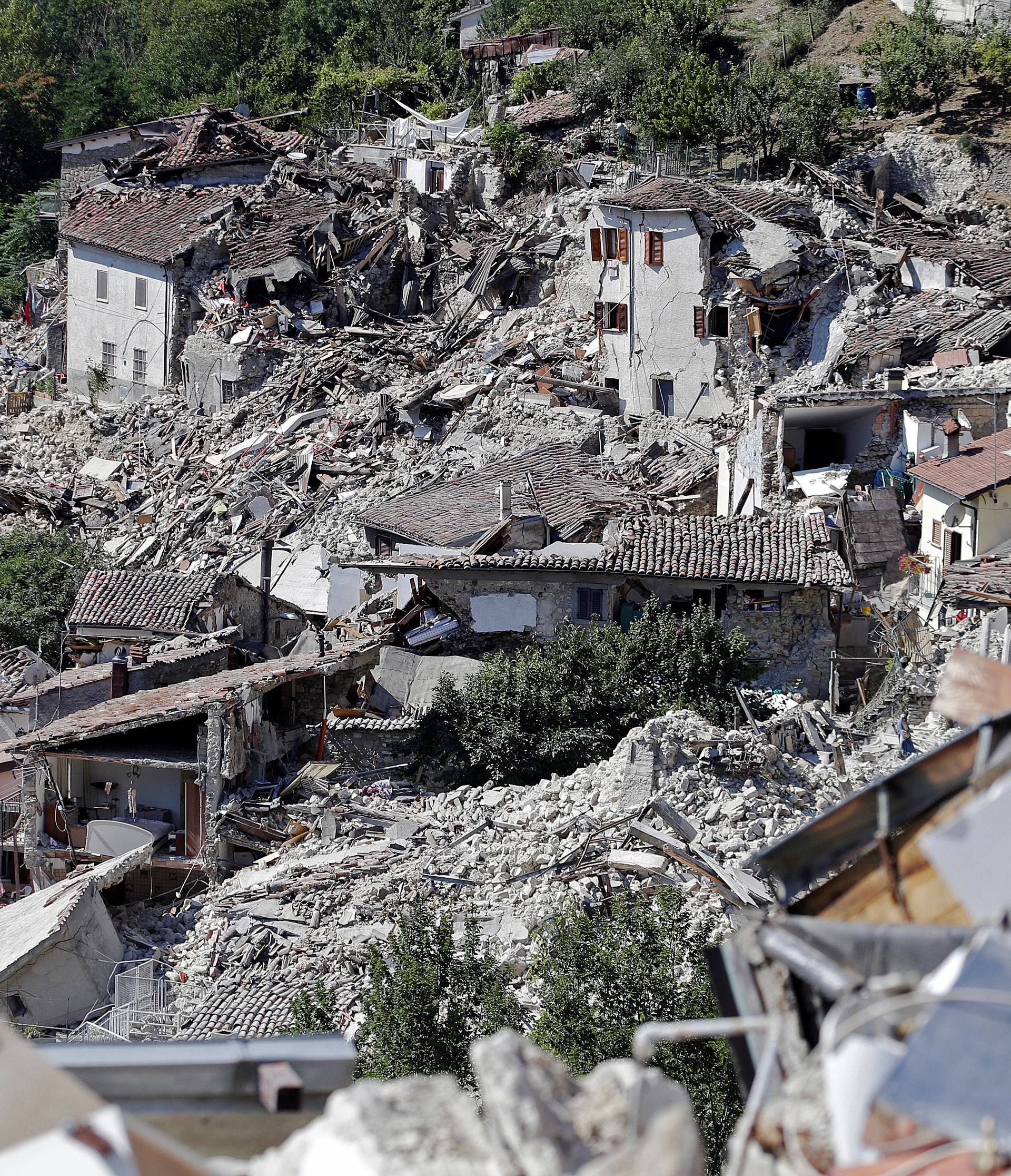 Collapsed houses are seen following an earthquake in Pescara del Tronto