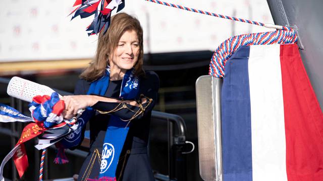 FILE PHOTO: Caroline Kennedy, the daughter of late President John F. Kennedy christens the aircraft carrier USS John F. Kennedy