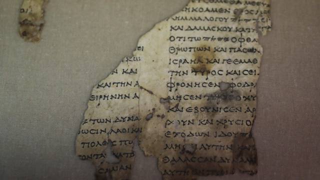 A recently-discovered scroll fragment of an ancient biblical text is seen at Israel Antiquities Authority laboratories in Jerusalem