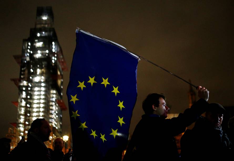 An anti-Brexit protester demonstrates outside the Houses of Parliament in London