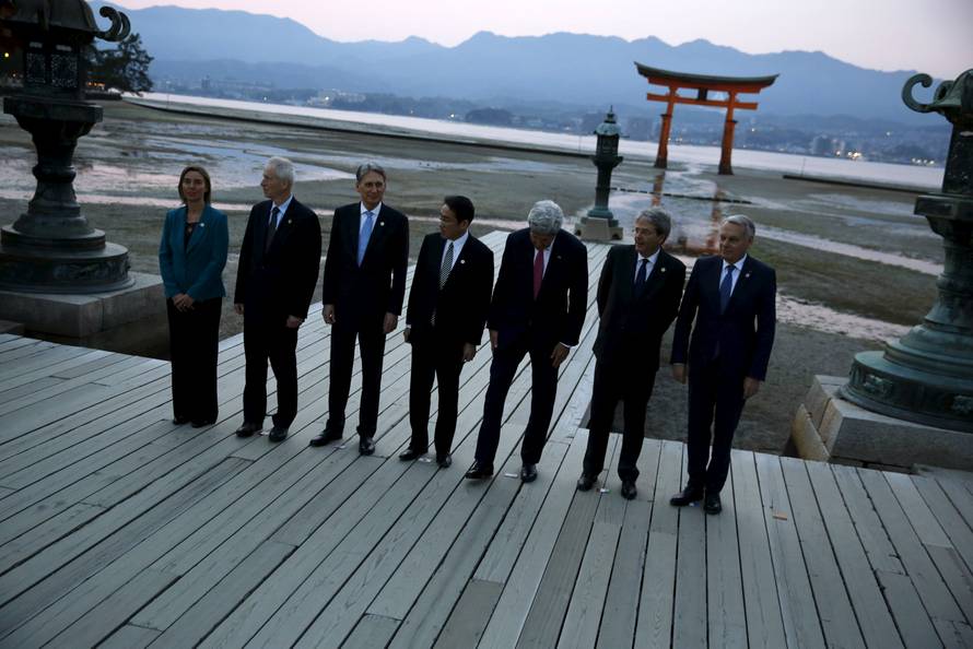 G7 foreign ministers take a family photo at the Itsukushima Shrine as they take a cultural break from their G7 Foreign Minister meetings in nearby Hiroshima to visit Miyajima Island