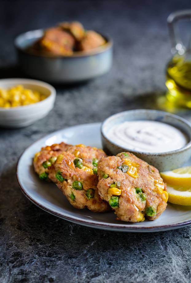 Tuna Fish cakes with green peas, corn and scallion served with s