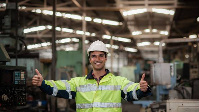 Happy,Young,Indian,Male,Engineer,Wearing,Safety,Workwear,Standing,In