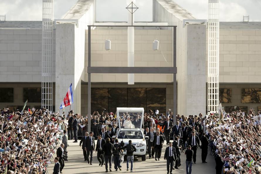 Pope Francis waves as he arrives at the Shrine of Our Lady of Fatima in Portugal