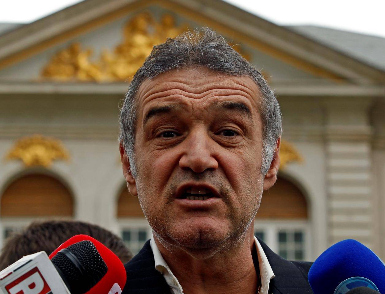 FILE PHOTO: Romanian lawmaker and soccer club owner George Becali  talks to the media in Bucharest