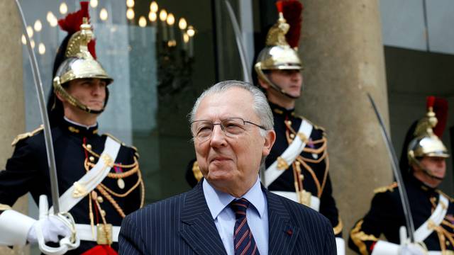 FILE PHOTO: Jacques Delors, former European commission President and former Socialist minister, leaves the Elysee Palace in Paris