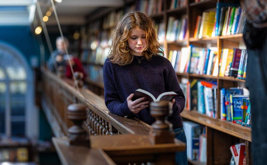 Teenage,Girl,Reading,The,Book,In,The,Marylebone,Bookstore,In
