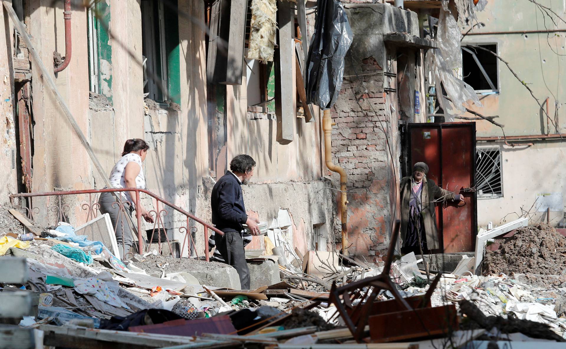 A view shows a damaged residential building in Mariupol