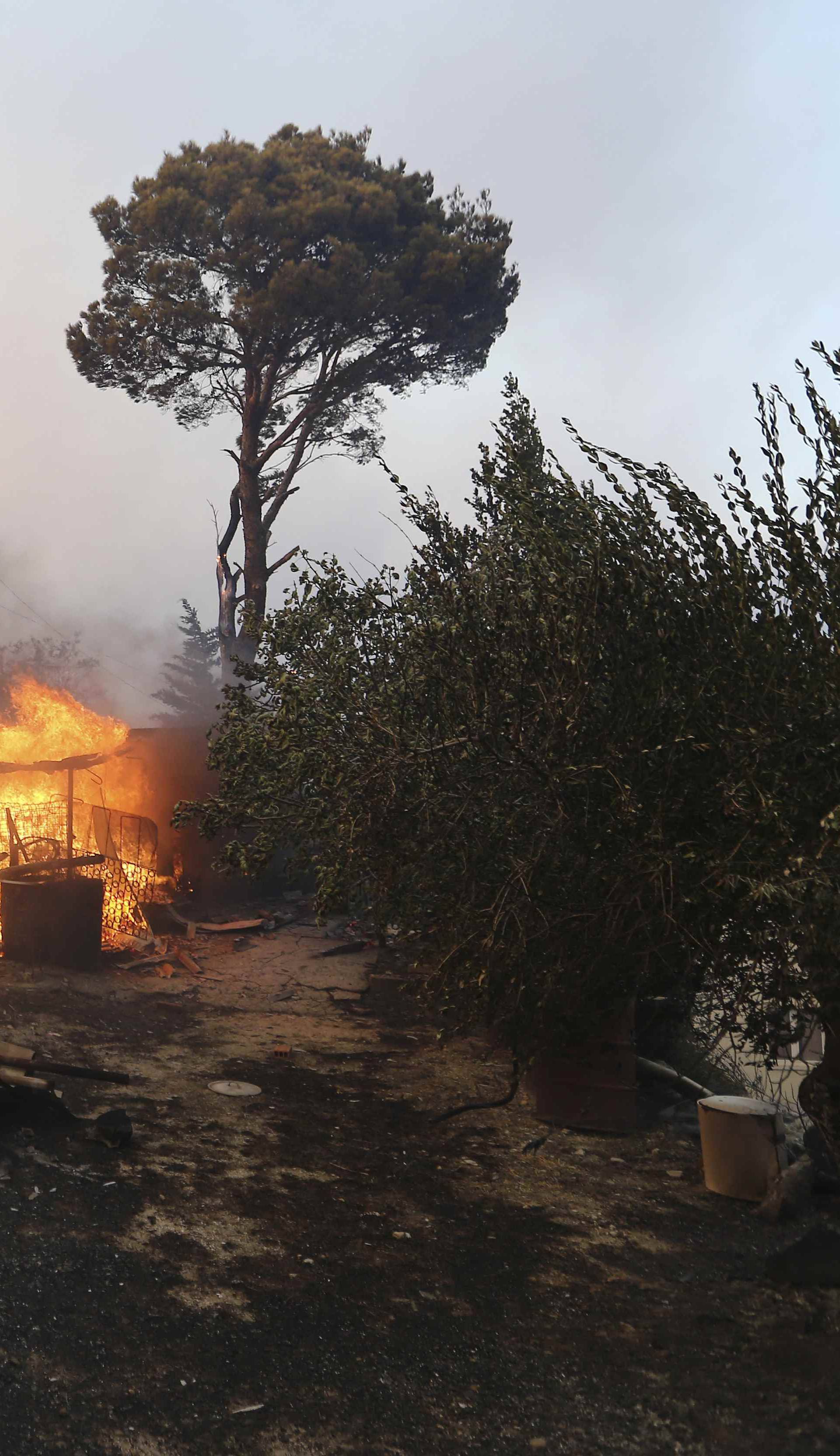 A wildfire is seen in the village of Mravince near Split,