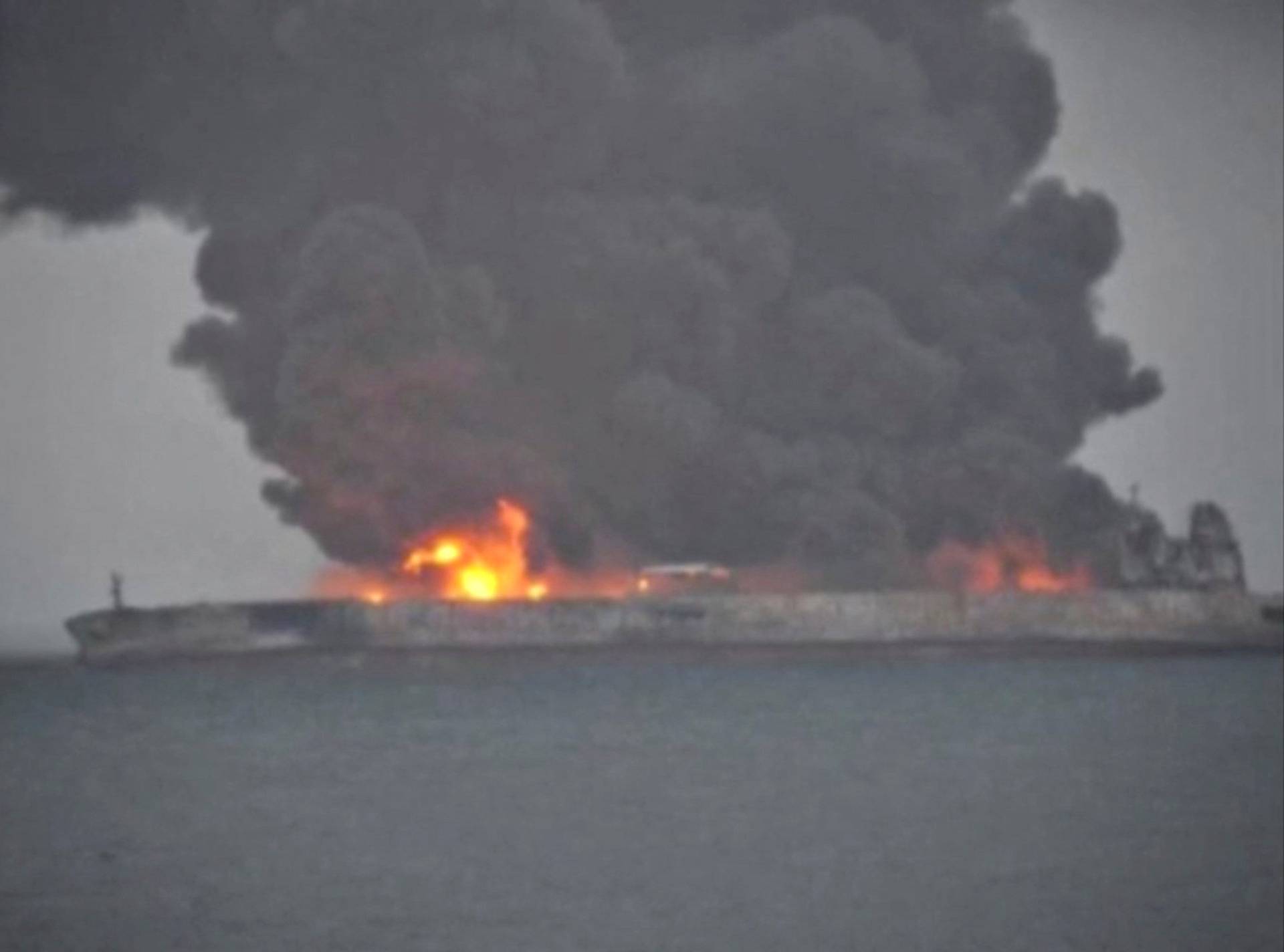 Smoke and fire is seen from Panama-registered tanker Sanchi carrying Iranian oil after it collided with a Chinese freight ship in the East China Sea
