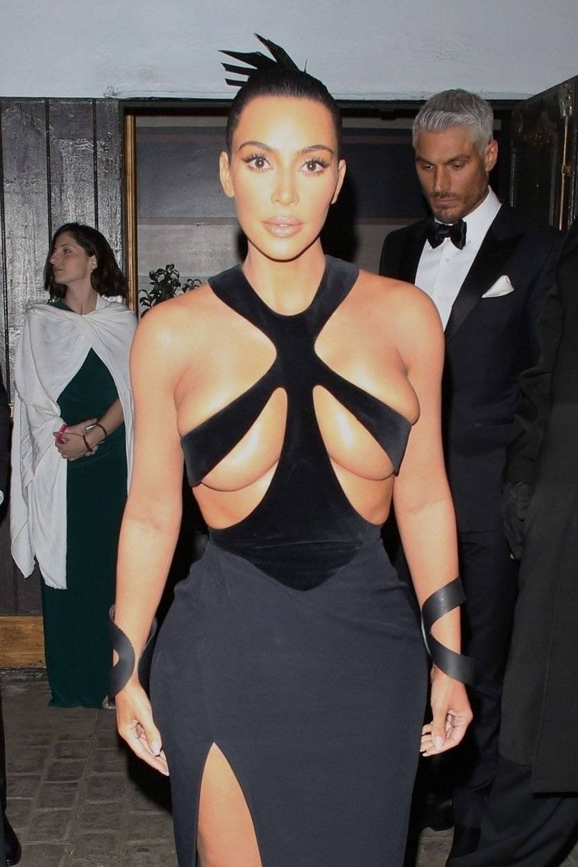 Kim Kardashian leaves little to the imagination in sexy strapped gown during outing in Los Angeles