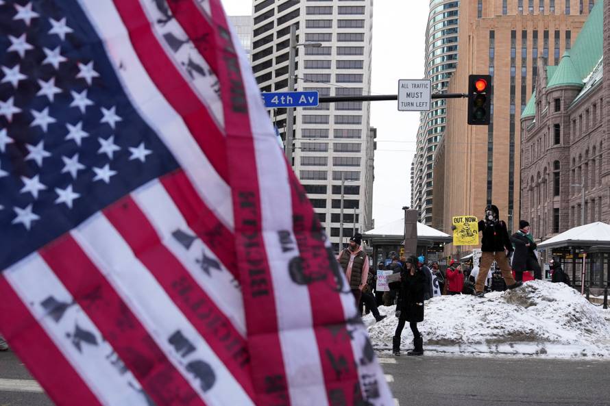 People attend the "March Against Minnesota Fraud" in Minneapolis