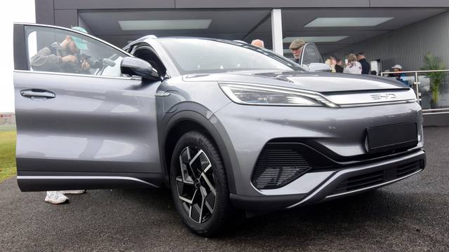 FILE PHOTO: Members of the press and the general public check out the Atto 3 electric SUV in Farnborough