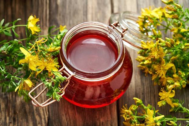 A jar of homemade red oil made from St. John's wort flowers