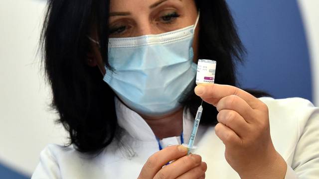 A health worker prepares to administer the AstraZeneca vaccine under the COVAX scheme against the coronavirus disease (COVID-19) in Pristina