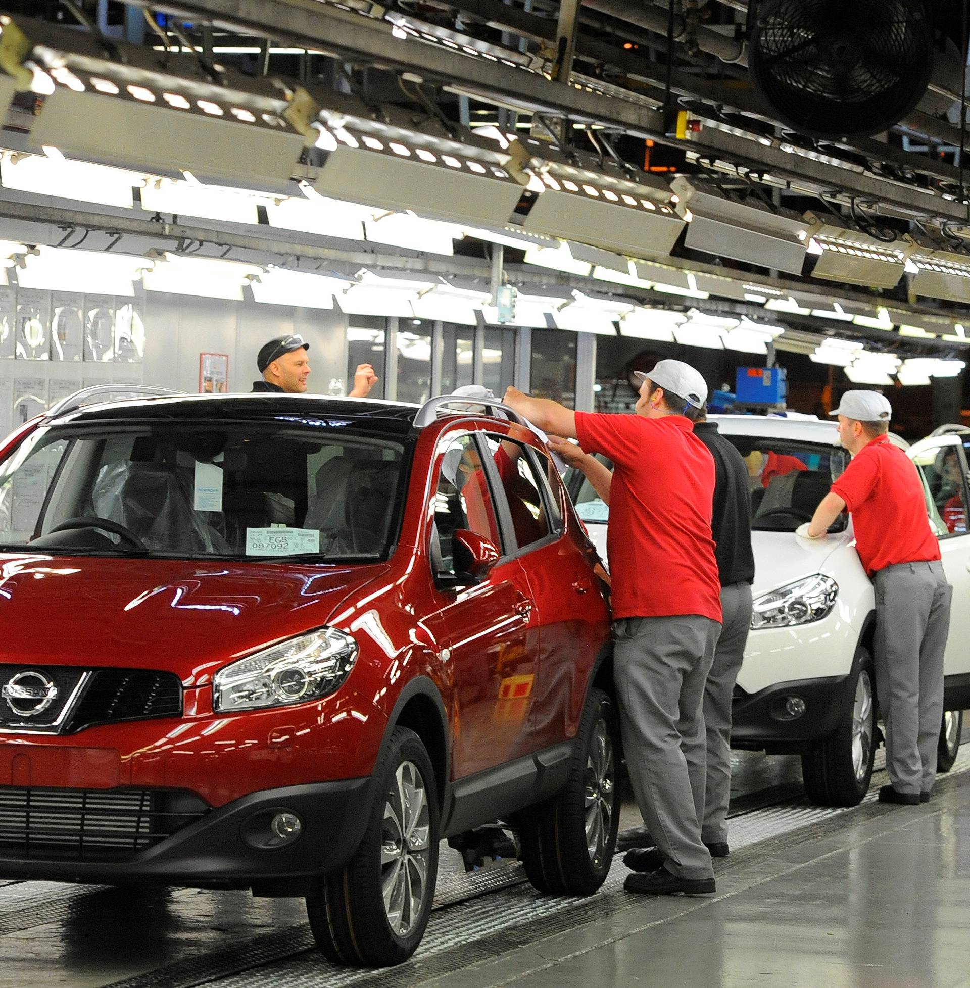 FILE PHOTO: A worker is seen completing final checks on the production line at Nissan car plant in Sunderland