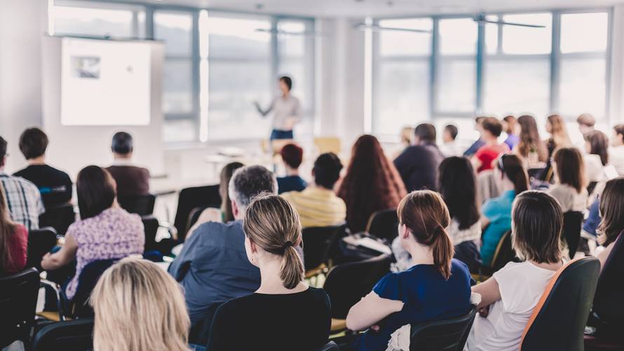 Business,And,Entrepreneurship,Symposium.,Speaker,Giving,A,Talk,At,Business