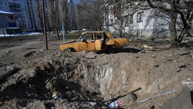 Shell crater in seen at a residential area in Sievierodonetsk