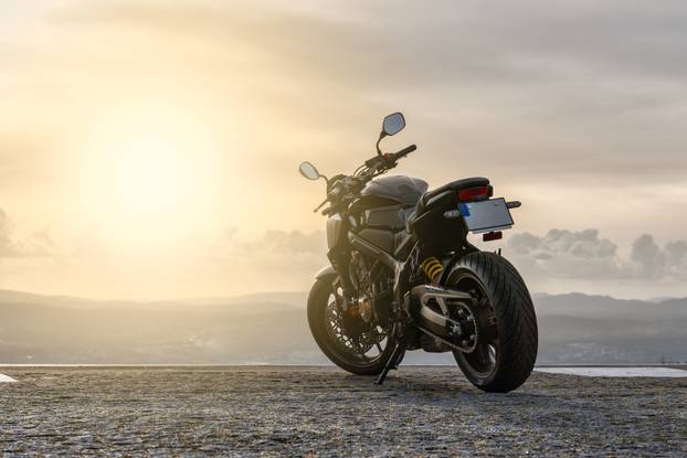Motorcycle,Parked,In,Front,Of,The,Sunset
