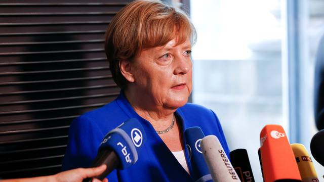 German Chancellor Angela Merkel gives a statement after the lower house of parliament Bundestag voted on legalising same-sex marriage, in Berlin