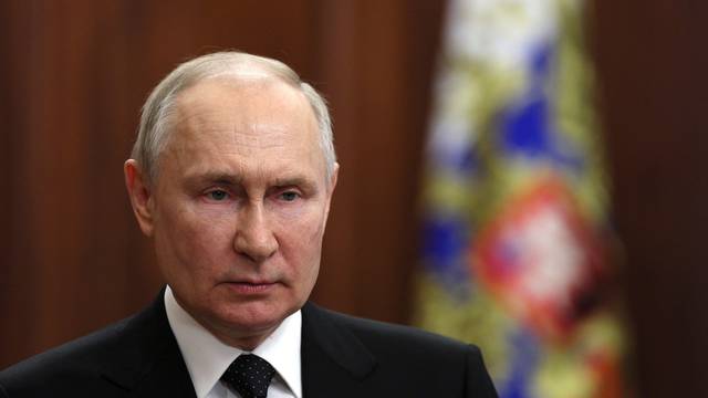 Russian President Vladimir Putin gives a televised address in Moscow