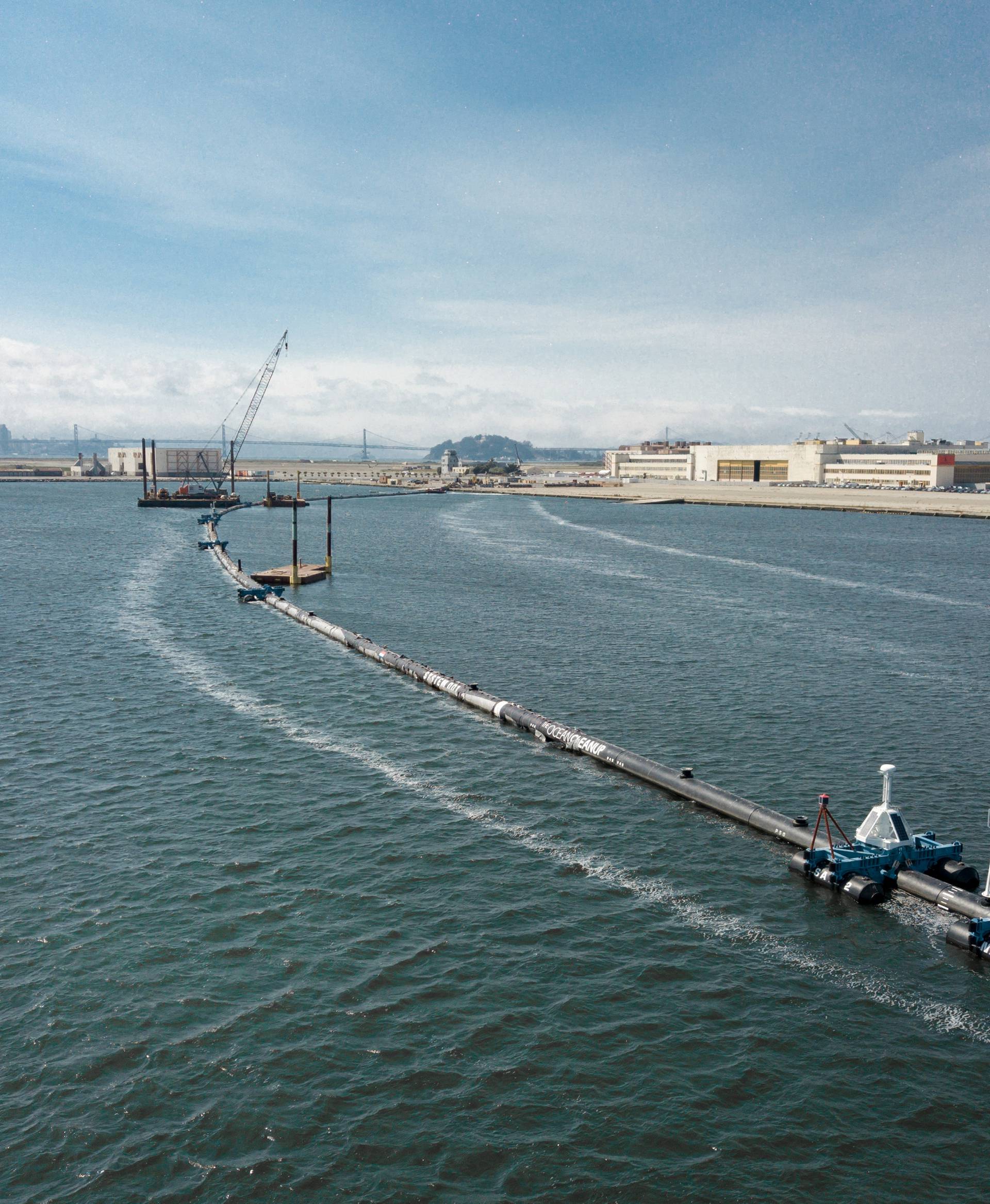 System 001, an ocean cleanup system that aims at removing plastic from the ocean, on the final day of the attachment of the screen in the water in Alameda