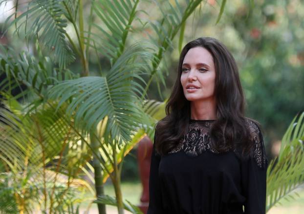 Actress Angelina Jolie arrives for a news conference at a hotel in Siem Reap