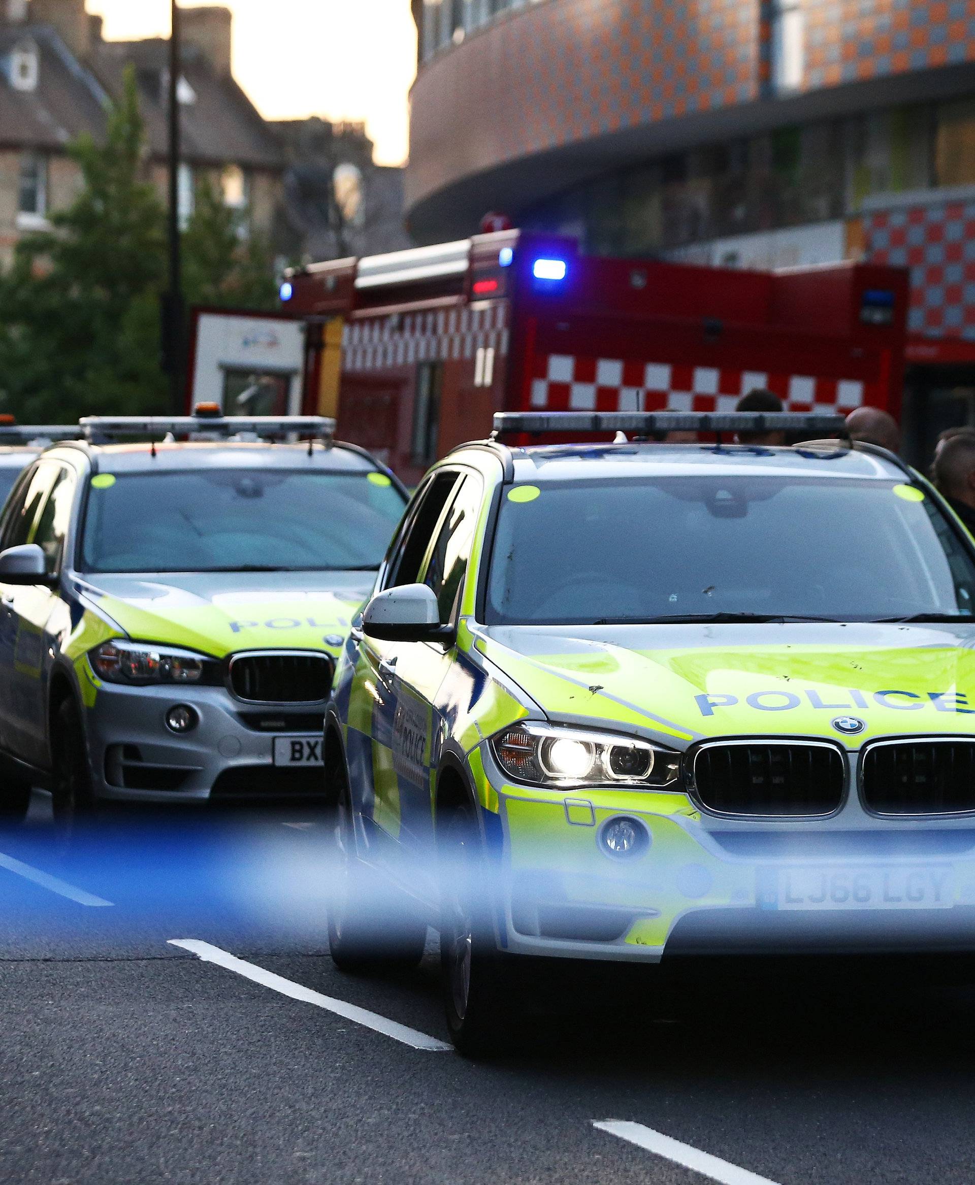 Police officers attend to the scene after a vehicle collided with pedestrians in the Finsbury Park neighborhood of North London