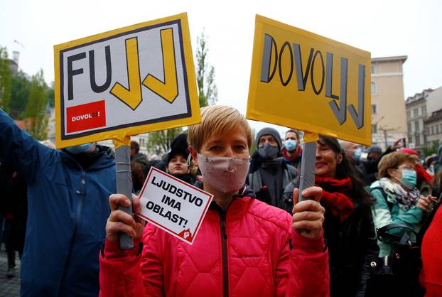 Demonstrators attend an anti-government protest in Ljubljana