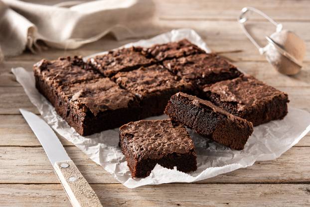 Homemade,Pieces,Of,Brownies,On,Wooden,Table