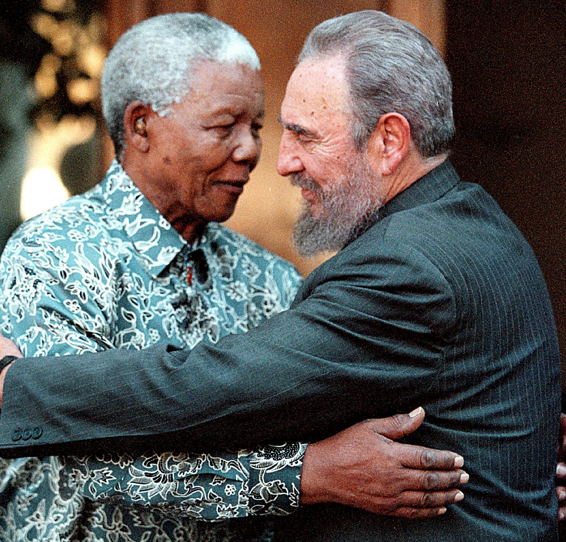 File photo of Cuba's President Fidel Castro and former South Africa's President Mandela in Johannesburg