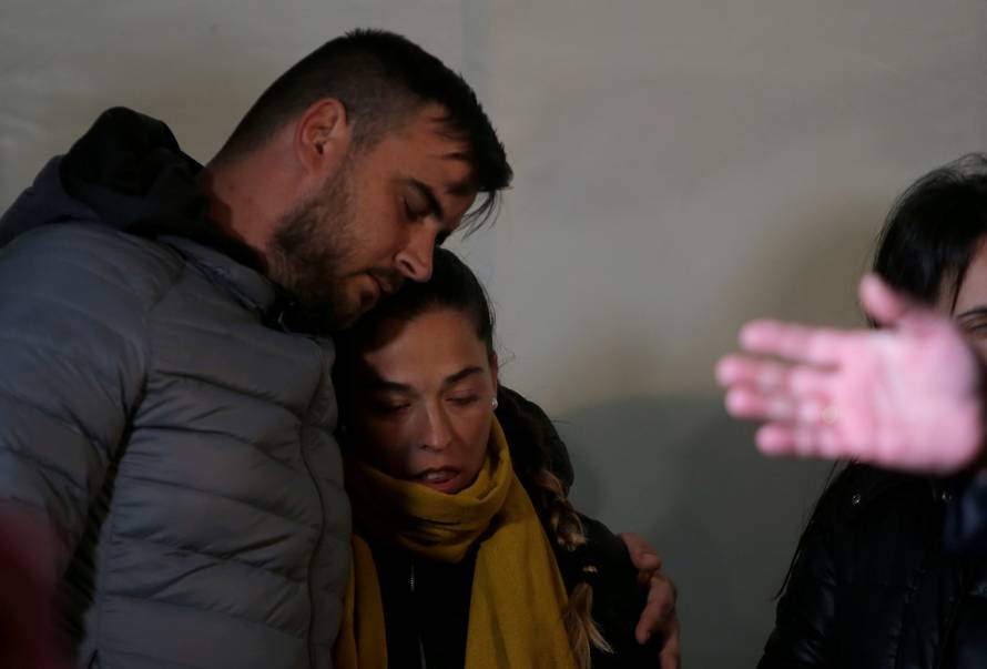 FILE PHOTO: FILE PHOTO: Julen's parents embrace each other during a vigil as a miner rescuer team descends into a drilled well at the area where Julen, a Spanish two-year-old boy, fell into a deep well, in Totalan