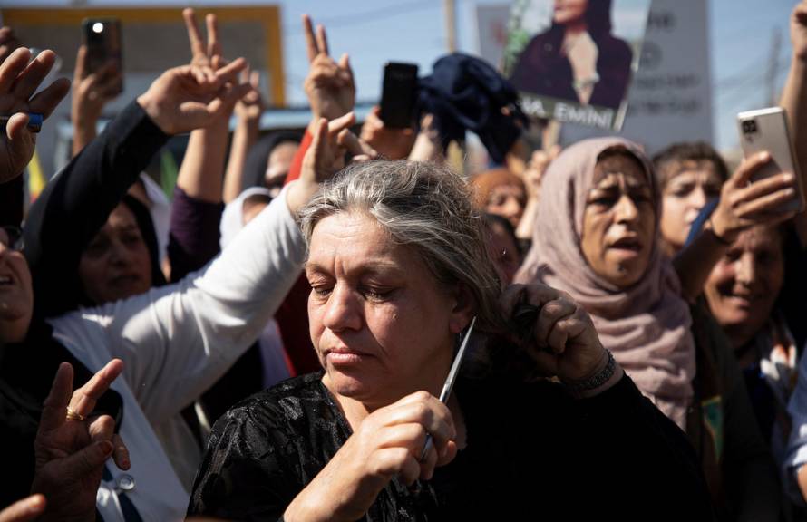 Women protest over the death of Mahsa Amini in Iran, in the Kurdish-controlled city of Qamishli