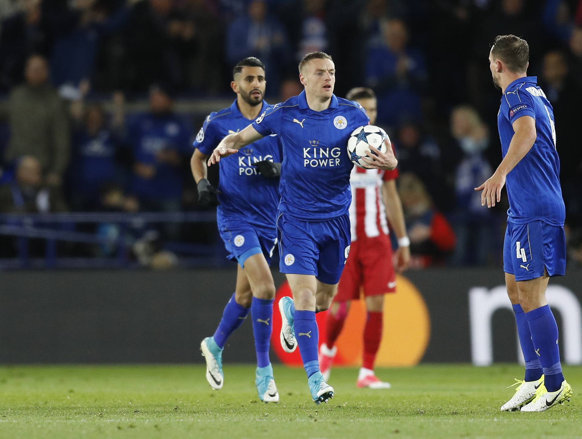 Leicester City's Jamie Vardy celebrates scoring their first goal with team mates