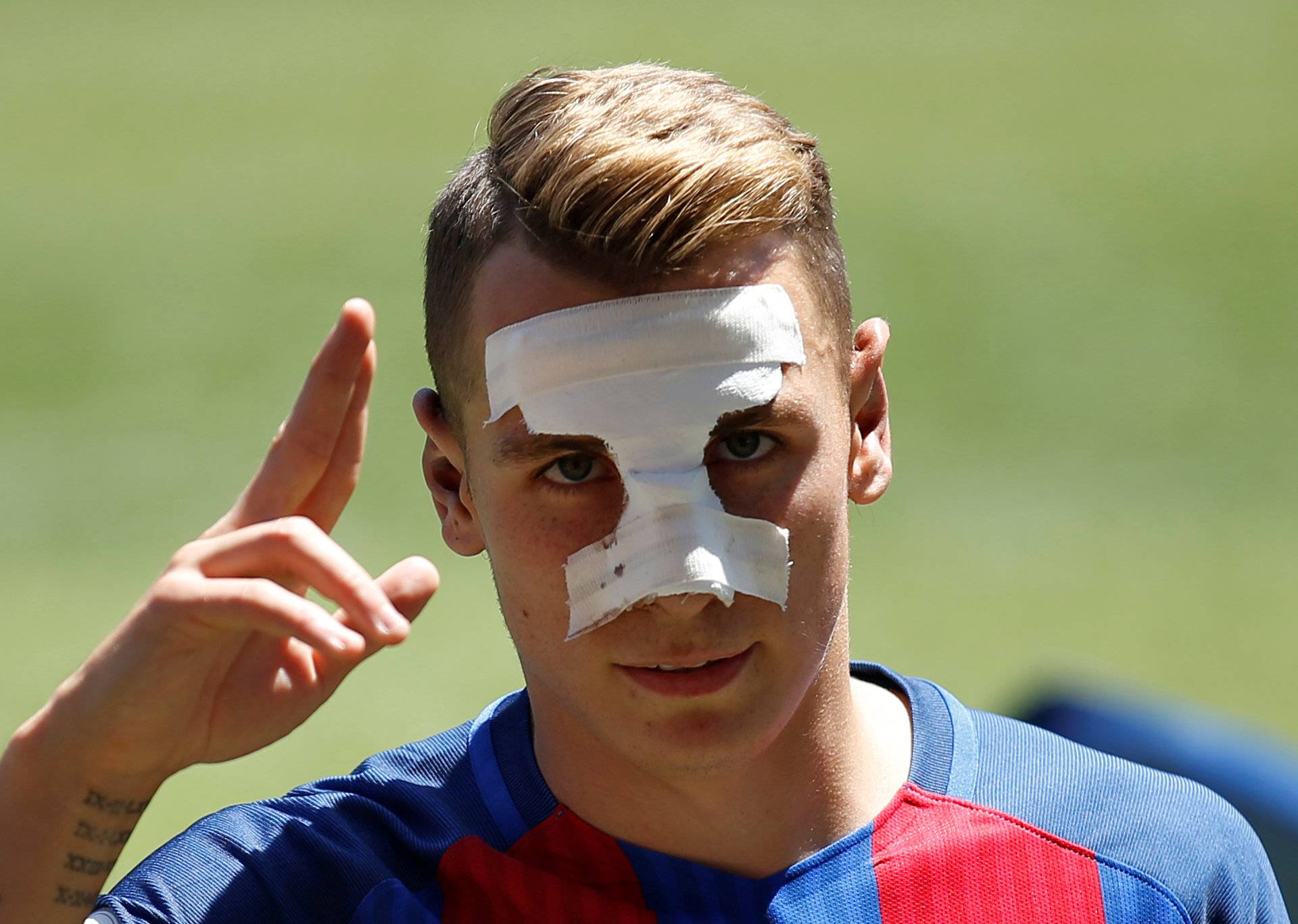 FC Barcelona's newly signed soccer player Lucas Digne salutes during his presentation at Camp Nou stadium in Barcelona