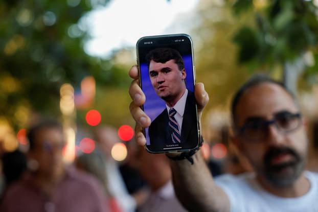 People mourn Charlie Kirk outside the U.S. embassy in Madrid