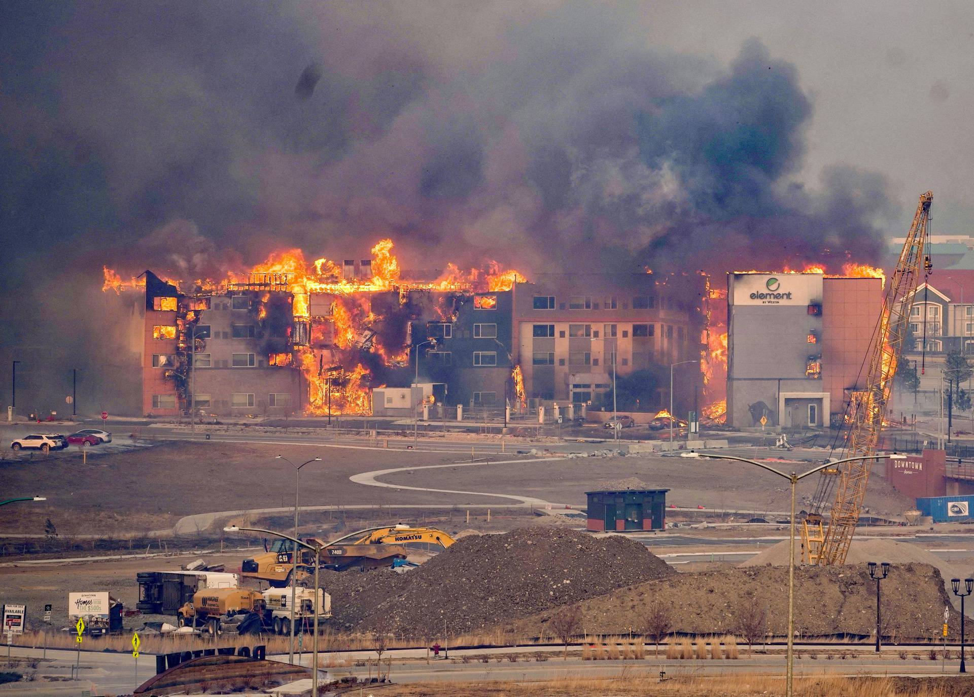 Structures burn as a wind-driven wildfire forced evacuation of Superior suburb of Boulder